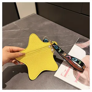 Close-up of a yellow star-shaped coin purse featuring lychee grain texture and silver zipper