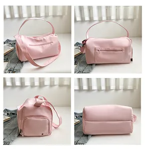 Sac de voyage rose en nylon avec compartiment à chaussures et poches multiples