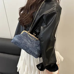 Blue denim shell bag with silver shimmer, gold kiss-lock and metal chain strap