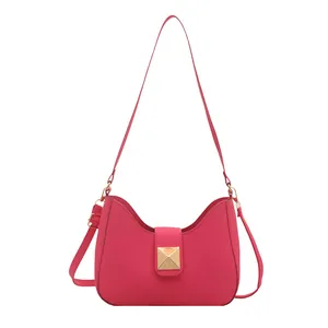 Elegant rose red crescent shoulder bag for women with gold metal buckle and sleek leather finish