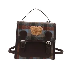 British style plaid backpack with brown faux leather trim and cute bear patch detail