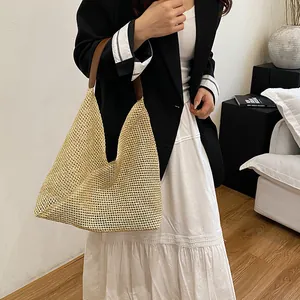Large hand-woven straw hobo shoulder bag for women with brown leather straps
