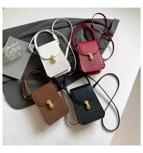 Mini crossbody bags in four colors with faux leather texture and golden metal twist locks