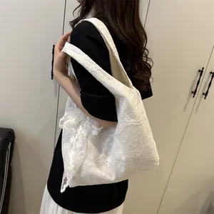 White lace tote bag with floral embroidery and wide shoulder strap in pastoral style