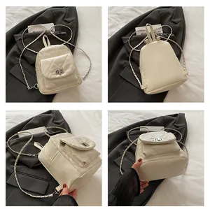 Detailed views of a beige quilted mini backpack with gold chain straps and metal twist lock