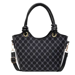 Sac seau monogramme classique noir et gris avec poignées rondes et détails dorés