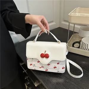 Cute white cherry print crossbody bag with 3D cherry buckle and top handle for women