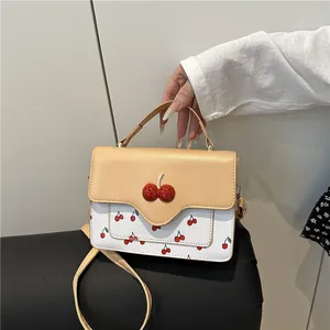 Cute cherry print crossbody bag with contrast beige and white leather patchwork design