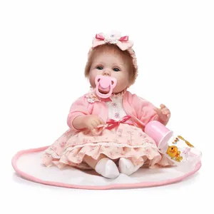 Realistic 22-inch reborn baby doll in pink floral dress with cardigan and nursing set
