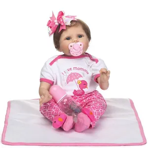 Lifelike reborn baby doll wearing I love mommy t-shirt with pacifier and bottle accessories