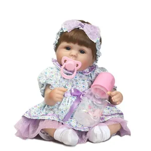Poupée bébé Reborn réaliste en robe à fleurs bleues avec biberon et tétine accessoires
