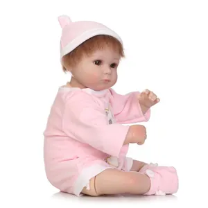 Poupée bébé Reborn réaliste avec cheveux bruns en tenue rose de dessin animé cadeau