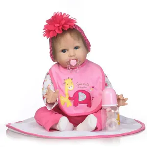 Lifelike reborn baby doll set with pink headband, pacifier, giraffe bib and feeding bottle