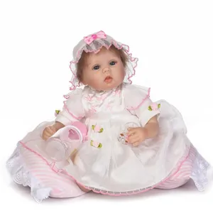 Realistic reborn baby doll in white lace princess dress with magnetic pacifier and bottle