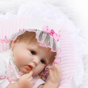 Realistic reborn baby doll with blue eyes and white lace bonnet for Mother's Day gifts