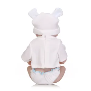 Rear view of a realistic reborn baby doll wearing a bear ear hat and white outfit