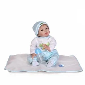 Lifelike reborn baby doll in blue striped outfit with pacifier and feeding bottle set