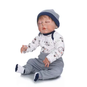 Sleeping reborn baby doll in striped blue outfit made of washable full body silicone material