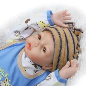 Realistic reborn baby doll in blue giraffe outfit with a soft striped knit hat