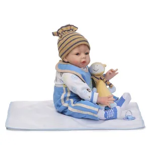 Lifelike reborn baby doll in blue striped outfit with yellow toy and blue pacifier