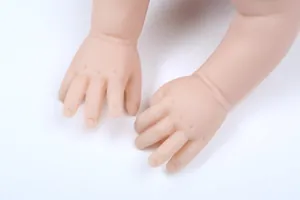 Detailed unpainted reborn baby doll hands kit with realistic skin textures and fingers