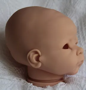 Unpainted reborn doll head kit in soft vinyl with realistic facial details for DIY