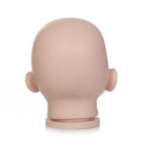 Back view of unpainted reborn doll head mold with ear details and neck marking