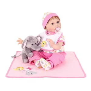 Realistic reborn baby doll in pink lion outfit with plush elephant and pacifier