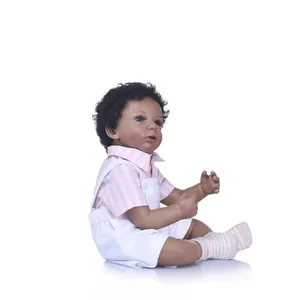Realistic African American reborn baby doll with curly hair in a pink striped outfit