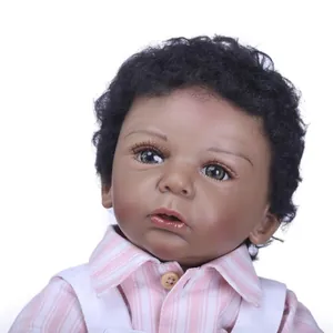 Lifelike African American baby doll with curly black hair in a pink striped outfit