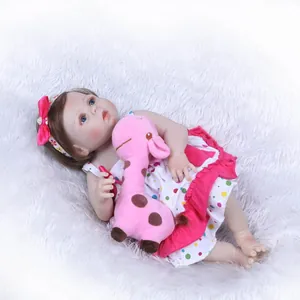 Realistic reborn baby doll in polka dot dress with giraffe plush on white fur carpet