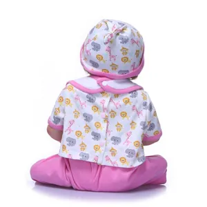 Rear view of a lifelike reborn baby doll wearing a pink animal print outfit and hat