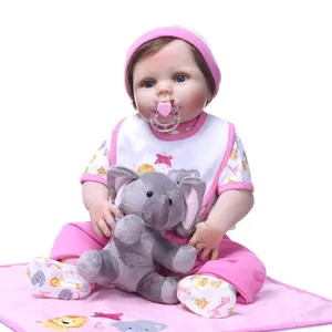 Lifelike reborn baby doll in pink elephant outfit with plush elephant and pacifier