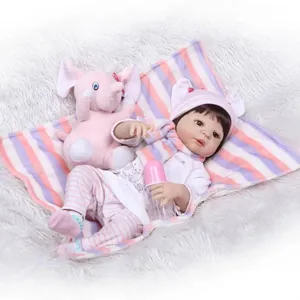 Realistic reborn baby doll in pink stripe outfit with plush elephant and bottle