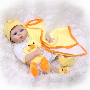 Lifelike reborn baby doll in polka dot romper with yellow duck theme and soft blanket
