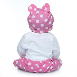 Three-piece baby doll outfit set with white bodysuit and pink polka dot pants