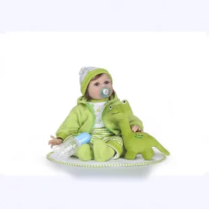Lifelike reborn baby doll in dinosaur outfit with pacifier and plush toy accessory