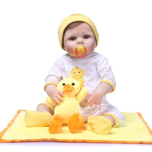 Lifelike full silicone reborn baby doll in yellow duck outfit with plush toy and pacifier