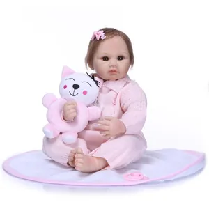 Realistic reborn baby doll in pink knit romper with plush toy and pacifier set