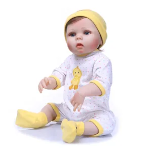 Detailed full silicone reborn baby doll wearing a yellow hat and white duck bodysuit