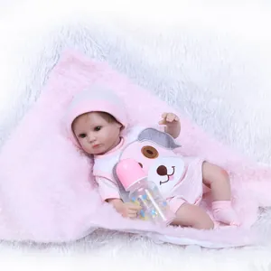 Realistic sleeping baby doll set with pink striped outfit and matching bottle accessory