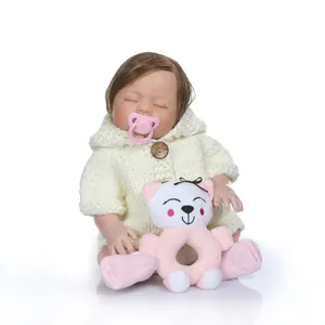 Realistic reborn baby doll in white knit hoodie and pink socks for early education