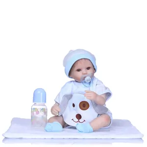 Detailed set of a reborn baby doll in blue outfit with feeding bottle and pacifier accessories