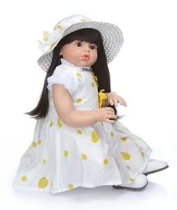 Detailed side view of a realistic doll wearing a white polka dot dress and straw hat