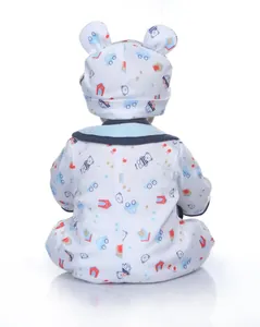 Back view of realistic baby doll wearing a soft cotton teddy bear print romper and hat