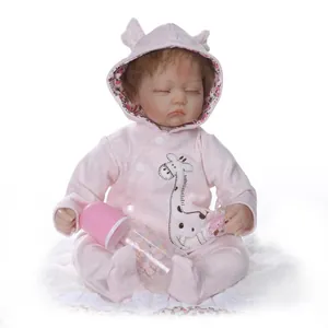 Realistic reborn baby doll sleeping in pink giraffe romper with bottle and pacifier
