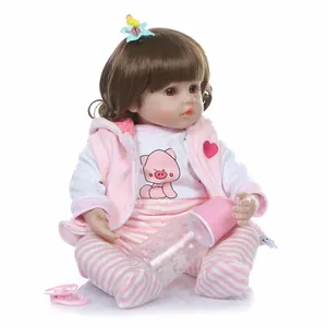Realistic long hair princess reborn doll with pink vest outfit and feeding bottle