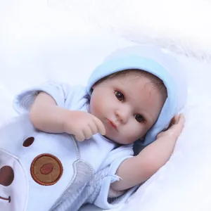Macro shot of realistic reborn baby doll features with blue striped outfit and bear pattern