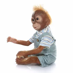 Detailed close-up of a lifelike baby orangutan doll with realistic skin and soft fur
