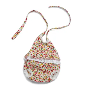 Body floreale in cotone con pizzo per bambole di 28cm dettaglio del tessuto